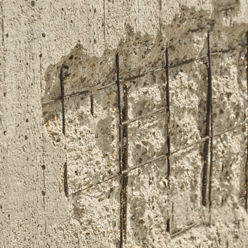 Close-up of spalling in concrete wall
